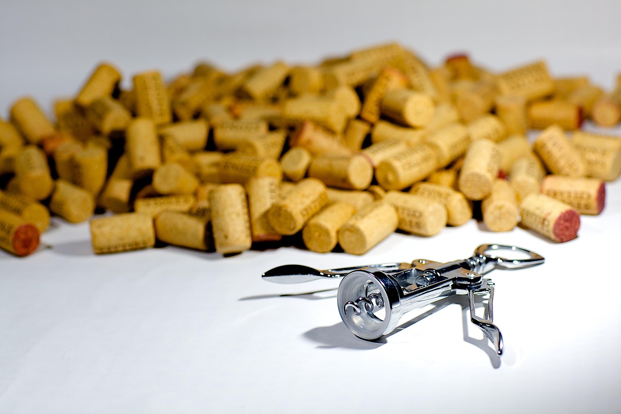 A corkscrew being used to open a bottle of wine